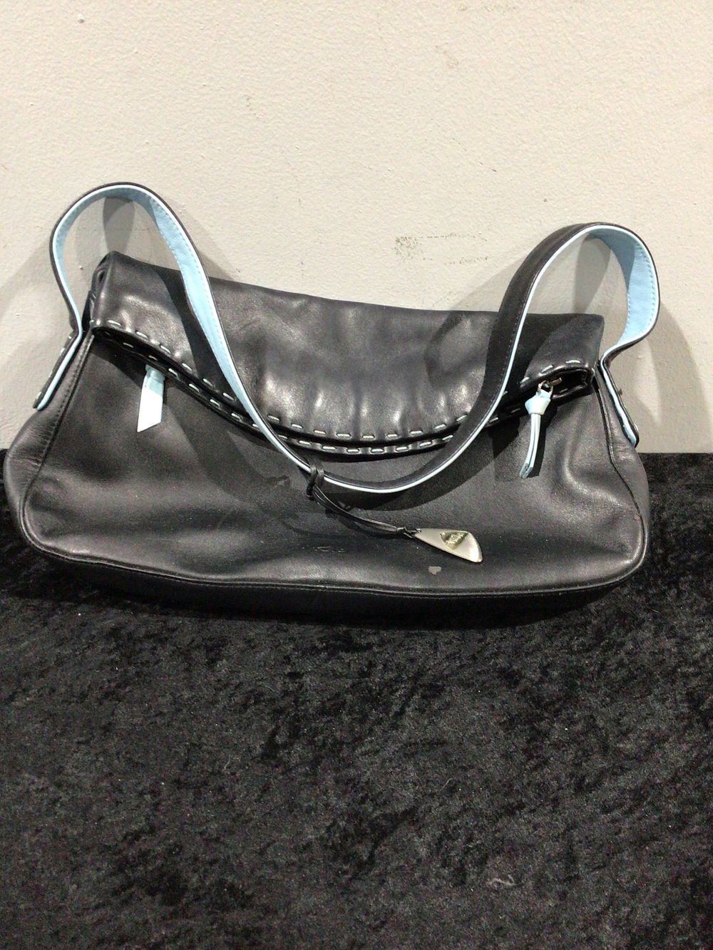 Lot 239: A Tula Black Leather Shoulder Bag with Light Blue Accents