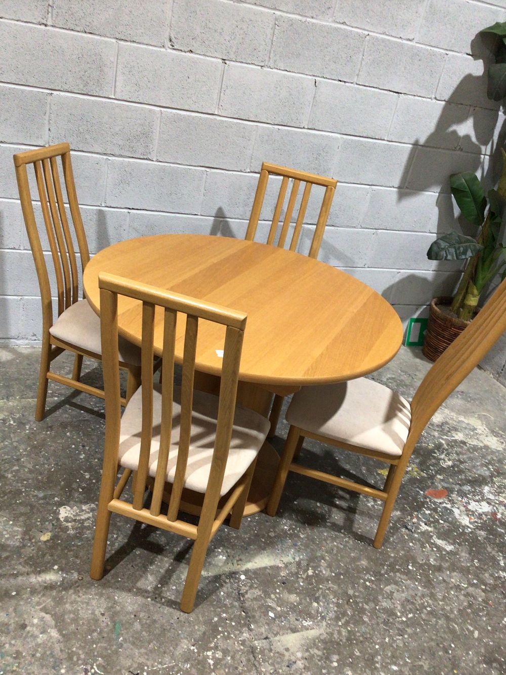 Lot 255: A Five-Piece Modern Beech Extending Dining Set