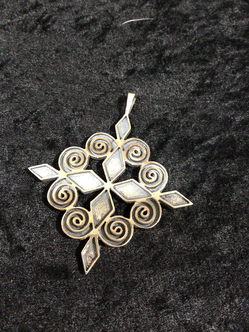 Lot 259: Sterling Silver Folk Art Pendant with Star and Spiral Motif