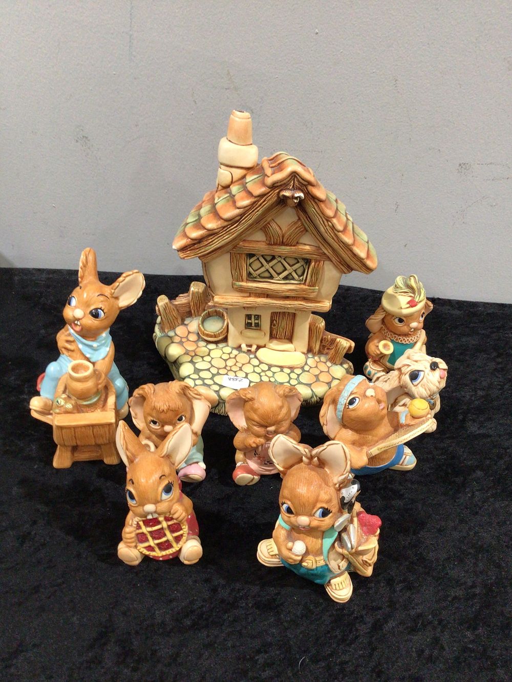 Lot 249: A Collection of Pendelfin Glazed Ceramic Rabbit Figurines and Cottage