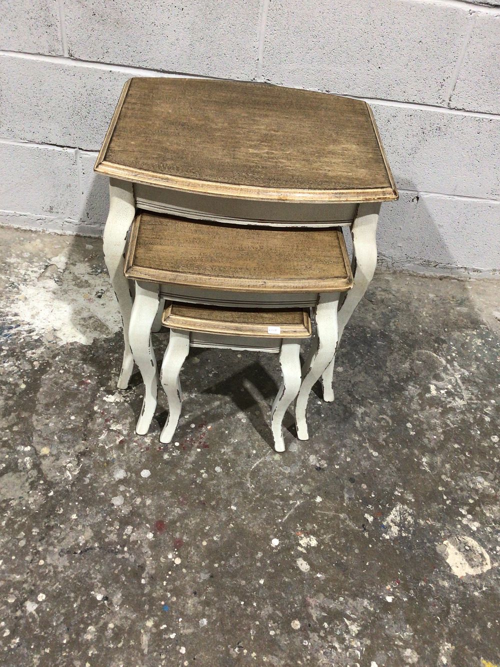 Lot 109: A Set of Three French Provincial Style Distressed Nesting Tables