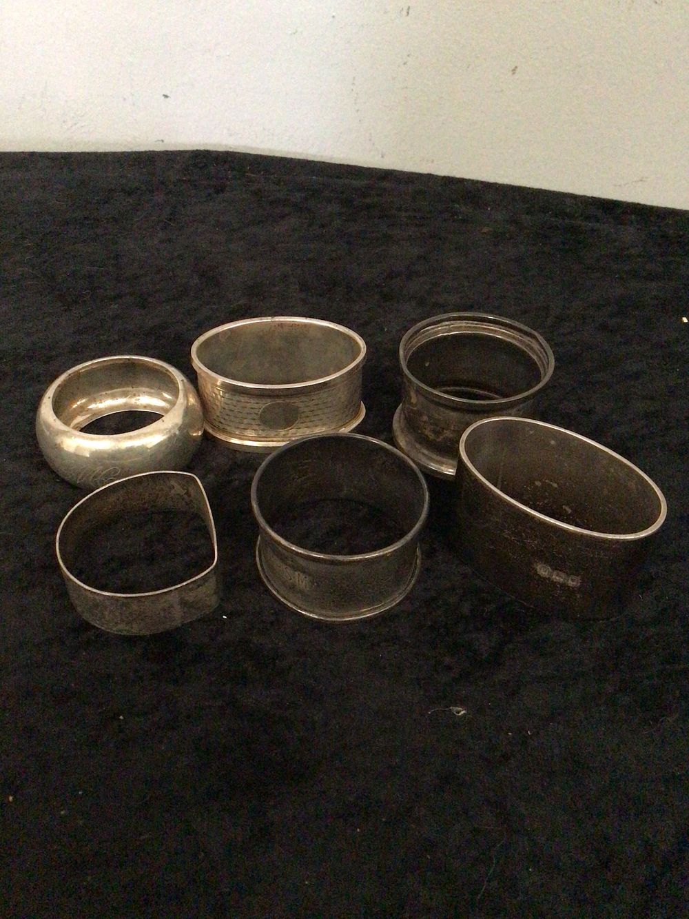 Lot 201: A Set of Six Assorted Silver Napkin Rings