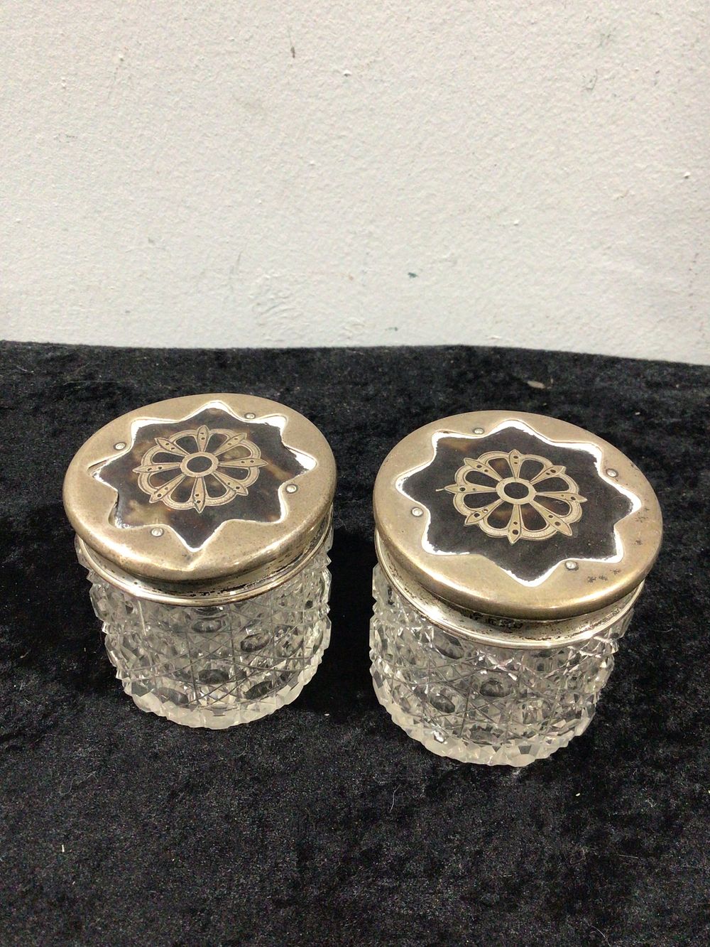 Lot 330: A Pair of English Cut Crystal Vanity Jars with Sterling Silver and Tortoise Shell Lids, circa 1923