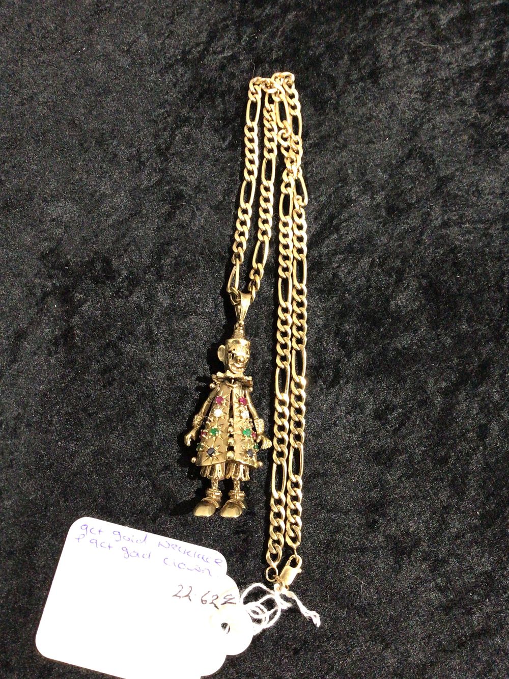 Lot 395: A 9ct Gold Articulated Clown Pendant and Chain