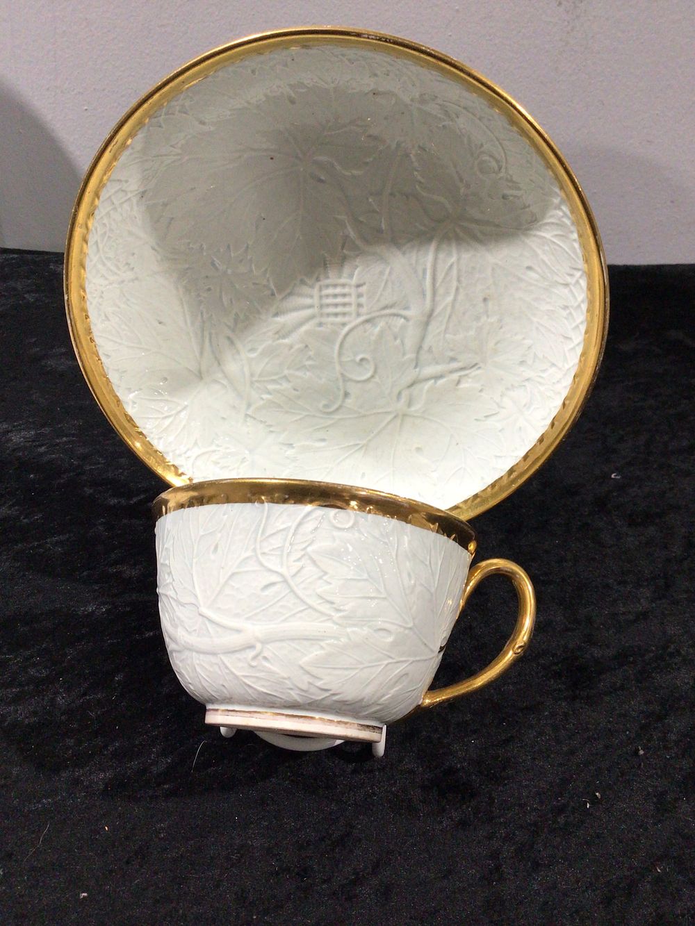Lot 198: Wedgwood 'Leaf & Vine' Gilded Teacup and Saucer