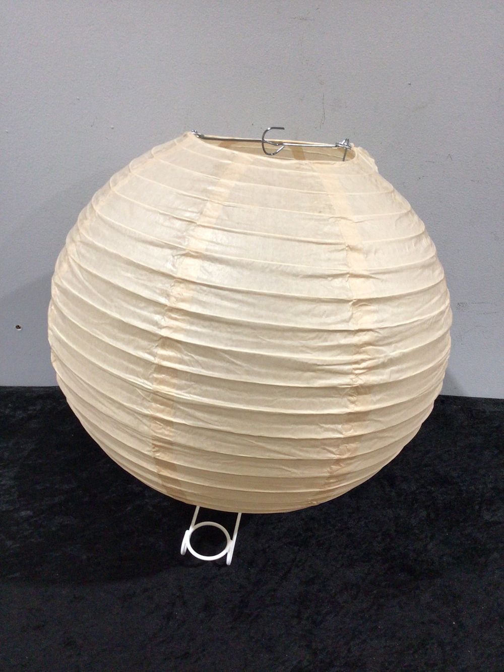 Lot 310: A Group of 50 14 Inch Ivory Round Paper Lanterns, Even Ribbing