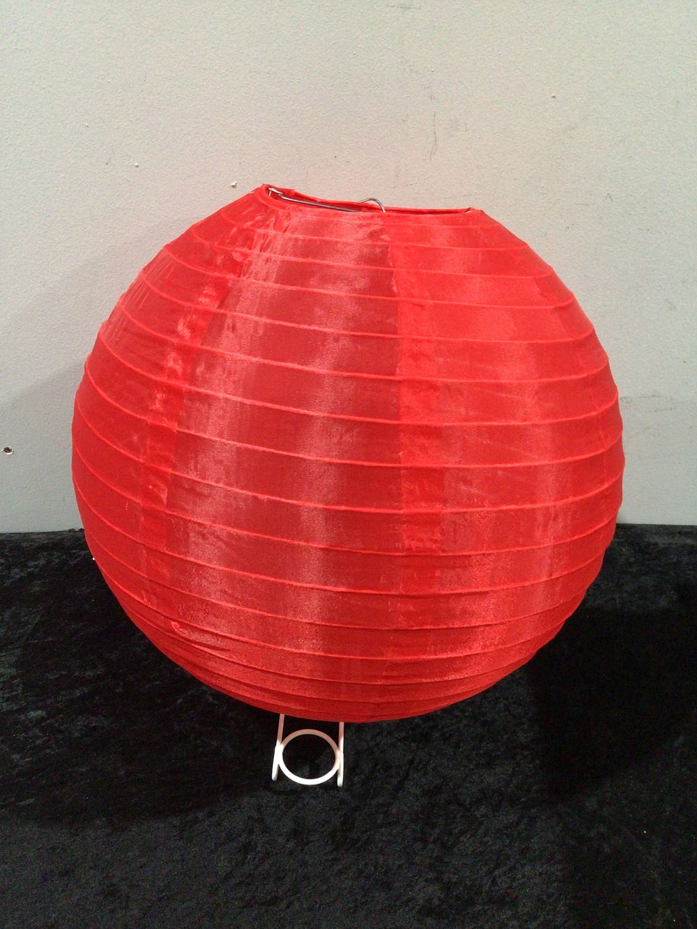 Lot 438: A Set of 60 Red Round Paper Lanterns