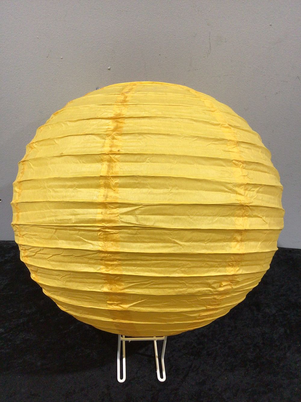 Lot 473: A Set of 60 Yellow 14-Inch Spherical Paper Lanterns