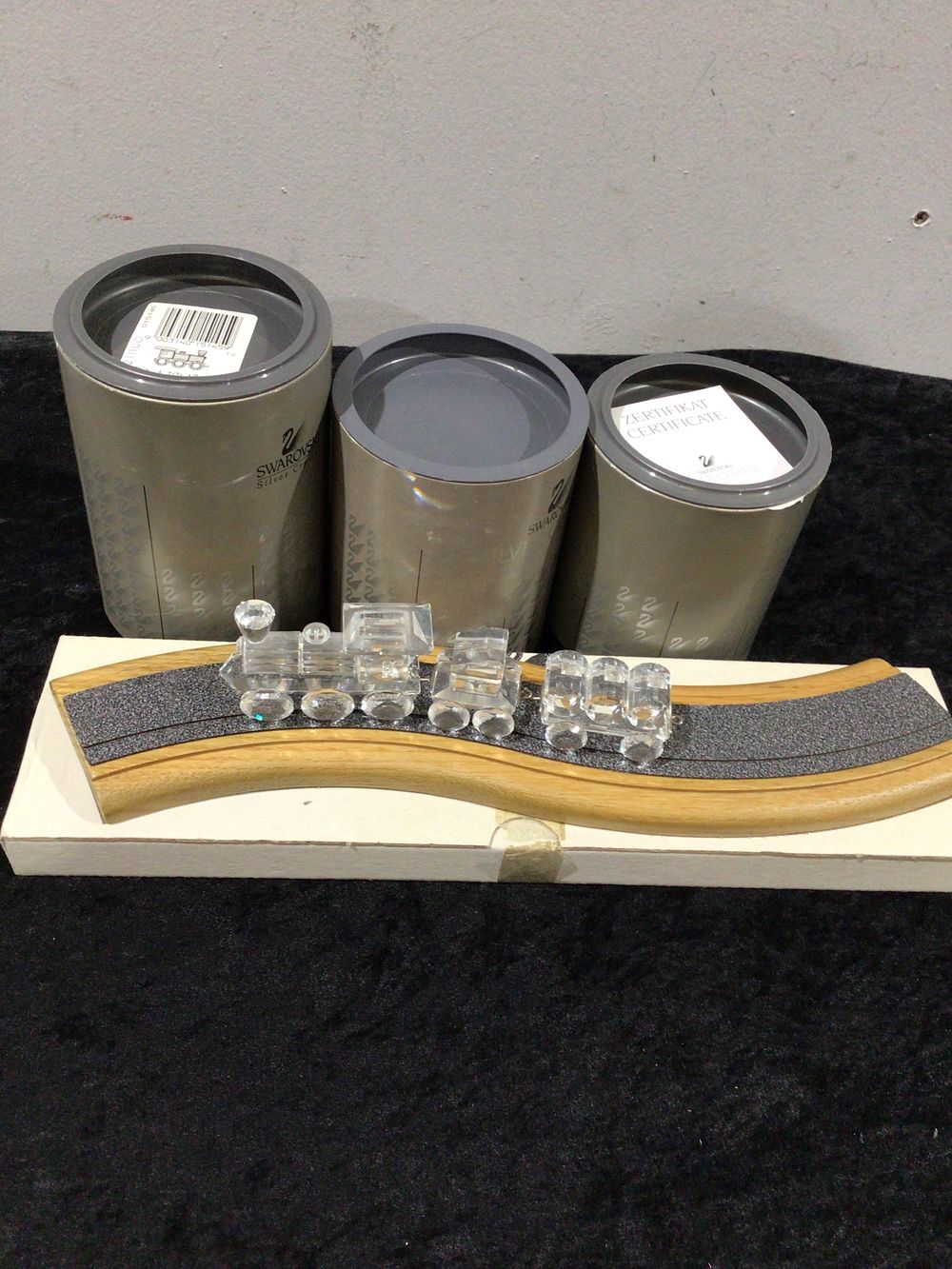Lot 194: Swarovski Three-Piece Crystal Train Set and Storage Boxes