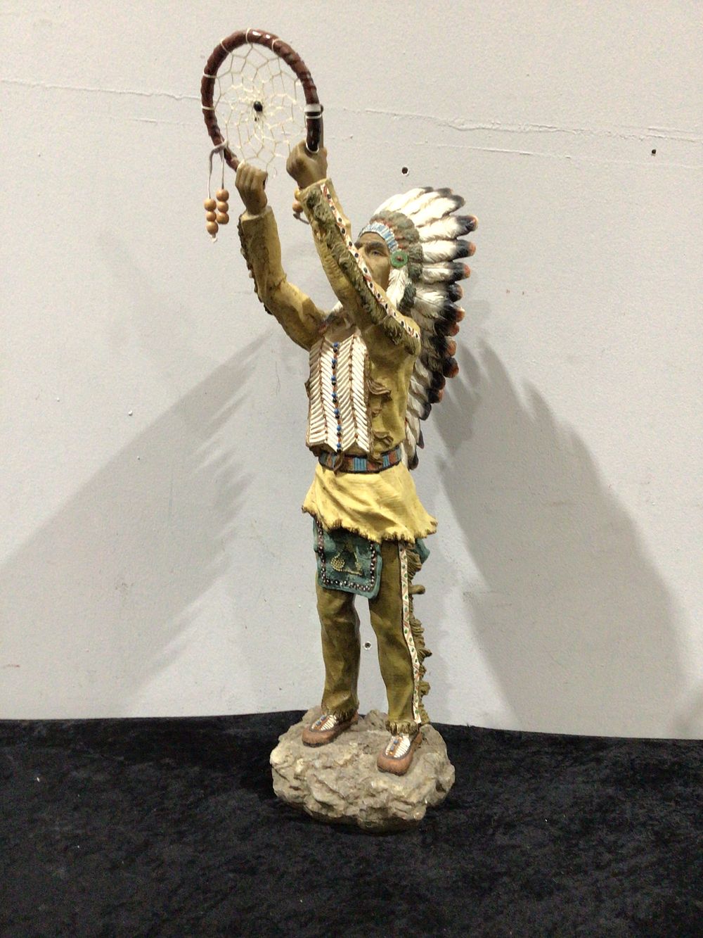 Lot 251: Native American-Inspired Figurine Holding Dreamcatcher