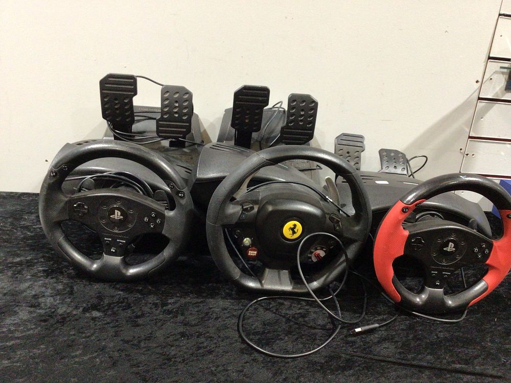 Lot 256: Three Thrustmaster Gaming Steering Wheel and Pedal Sets