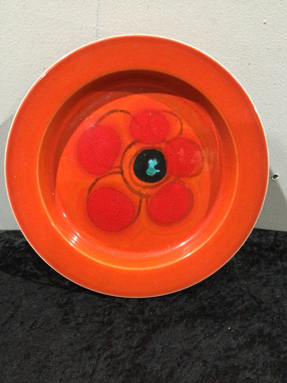 Lot 327: Orange Ceramic Plate with Abstract Floral Design, Pion