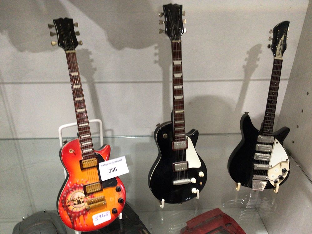 Lot 386: Three Miniature Les Paul Style Electric Guitars