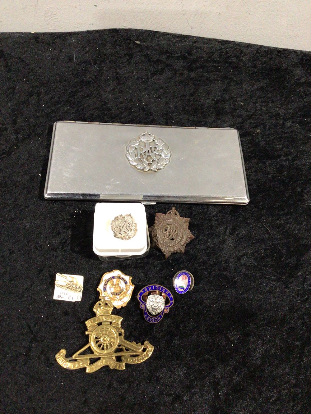 Lot 413: A Silver plated RAF Cigarette Case and Military Badges Collection