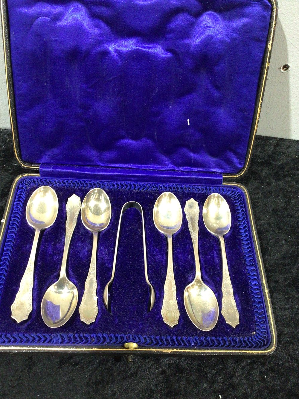 Lot 429: A Boxed Set of Six Sterling Silver Tea Spoons and Sugar Tongs