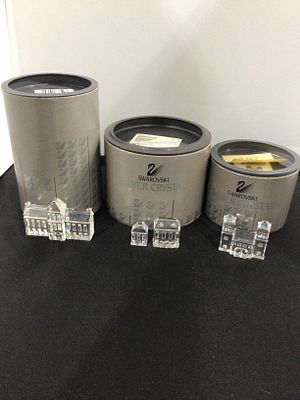 Swarovski Silver Crystal Group of Miniature Building Figurines with Three Presentation Boxes. A 