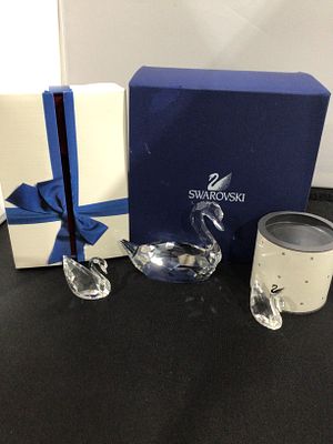 Three of Swarovski Crystal Swan Figurines with Original Packaging. Three Swarovski faceted clear 