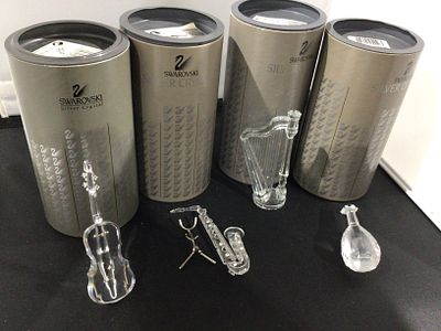 A Group of Swarovski Silver Crystal Musical Instruments with Original Packaging. A group of four 