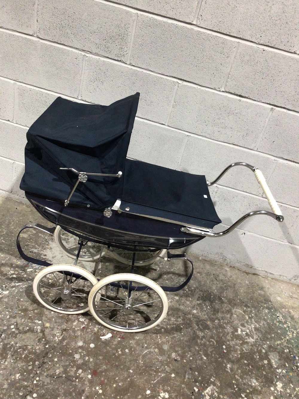 Lot 181: A Vintage Silver Cross Coach Built Baby Carriage, Navy Blue