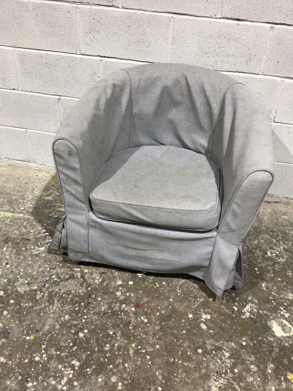 Lot 185: A Light Gray Upholstered Armchair with Slipcover