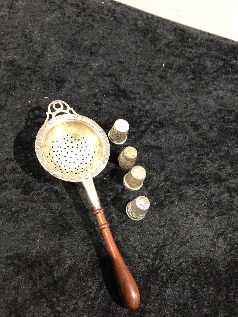 Lot 278: Vintage Silver Tea Strainer with Wood Handle, Made in England, and a Group of silver Thimbles