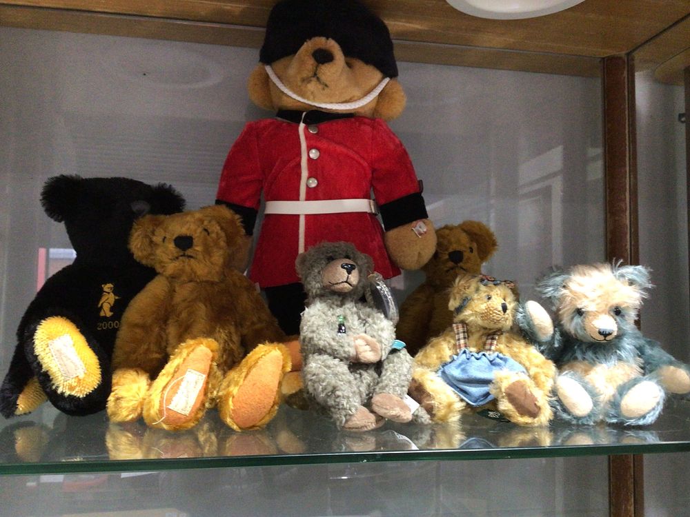 Lot 297: A Collection of Six Teddy Bears, including a Dean's Rag Book Co. Ltd. Example and a Queen's Guard Bear