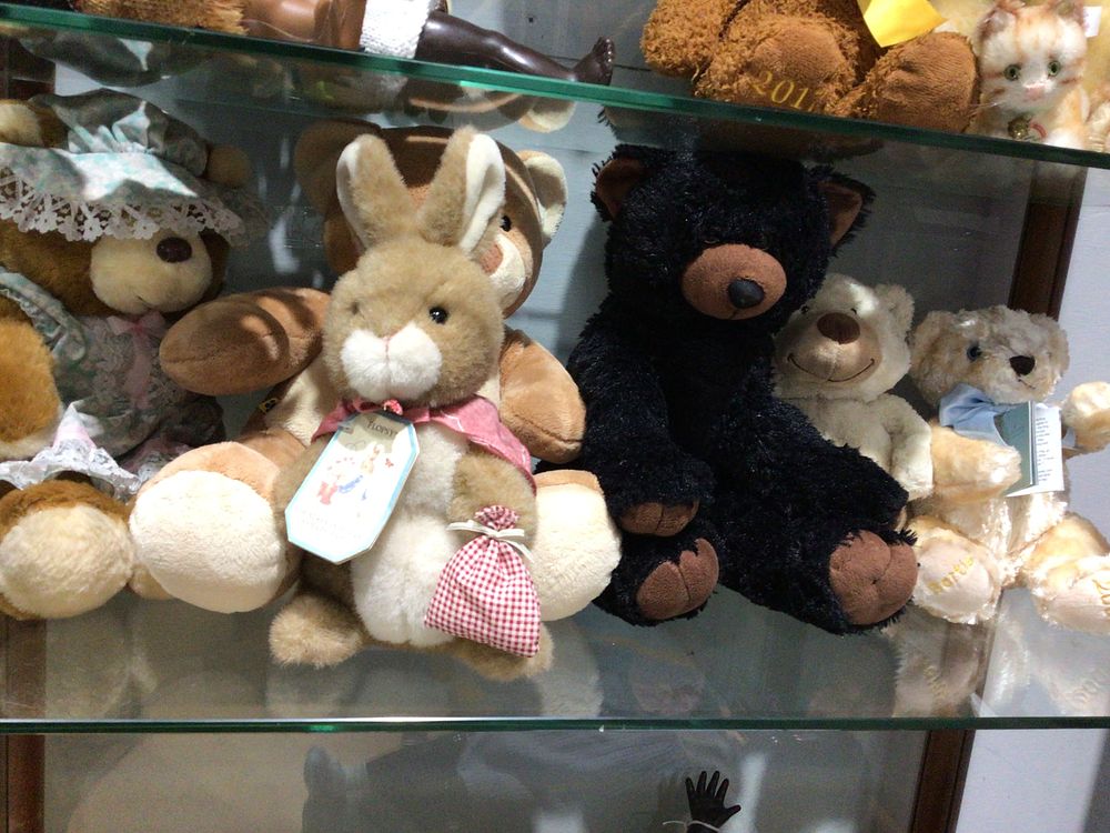 Lot 305: A Collection of Plush Toys, including a Black Plush Bear and a Beatrix Potter 'Flopsy' Rabbit