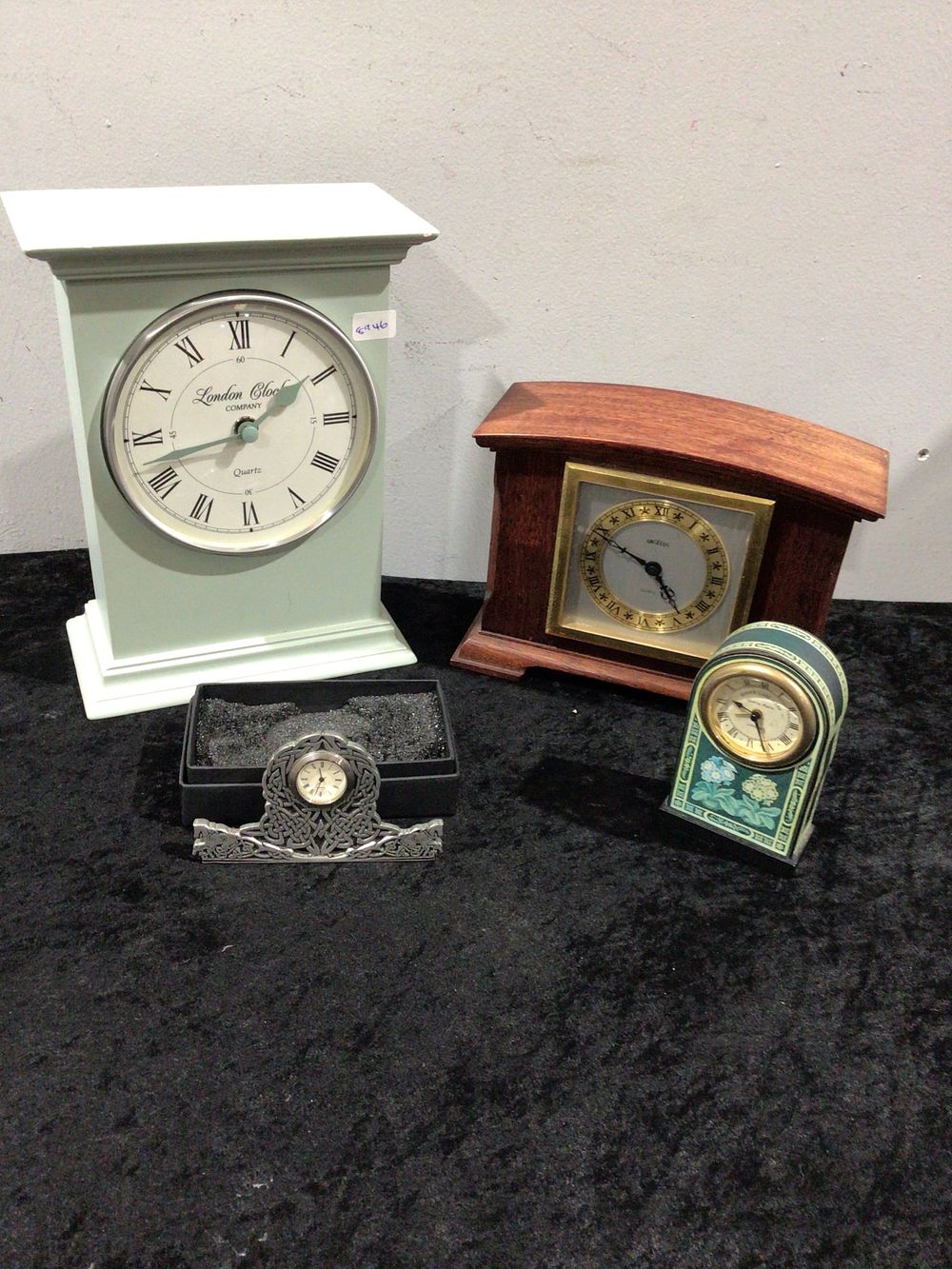 Lot 341: A Group of Four Modern Quartz Desk and Mantel Clocks