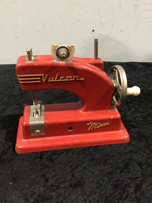 A Vintage Vulcan Minor Child's Toy Sewing Machine. A vintage Vulcan Minor child's toy sewing 