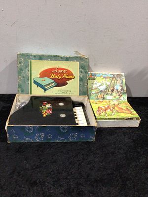 A Vintage 1950s 'Baby Piano' Child's Toy Piano, Made in the People's Republic of China, with an 