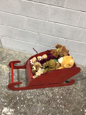 A Decorative Christmas Sleigh with a Collection of Plush Bears. This lot features a decorative 