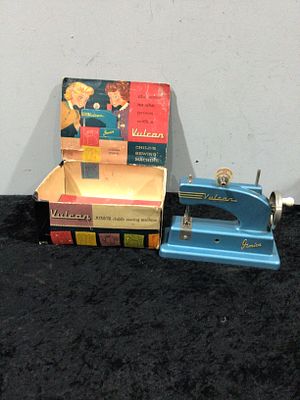 A Vintage Vulcan Junior Child's Sewing Machine with Original Box, circa 1950s. A vintage Vulcan 