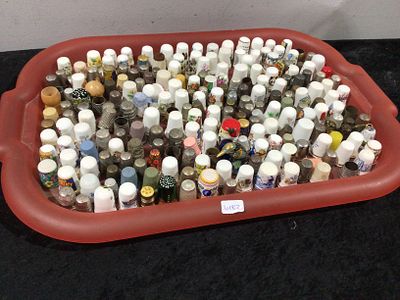 A Large Collection of Thimbles in a Display Tray. A large collection of approximately 200-300 