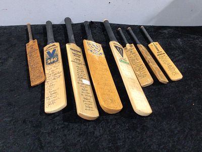 A Collection of Eight Vintage Signed Cricket Bats. This lot comprises eight vintage cricket bats 