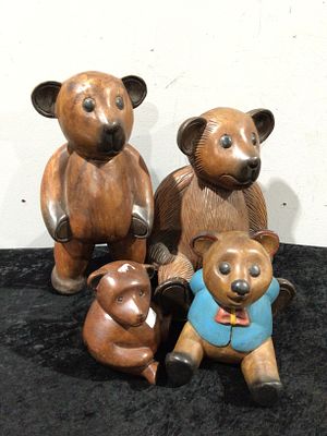 A Group of Carved Wooden Folk Art Teddy Bears. A group of four carved wooden bear figurines 