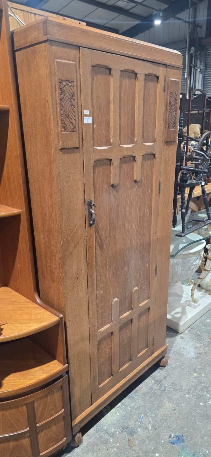 Lot 151: An Arts and Crafts Style Oak Single-Door Wardrobe