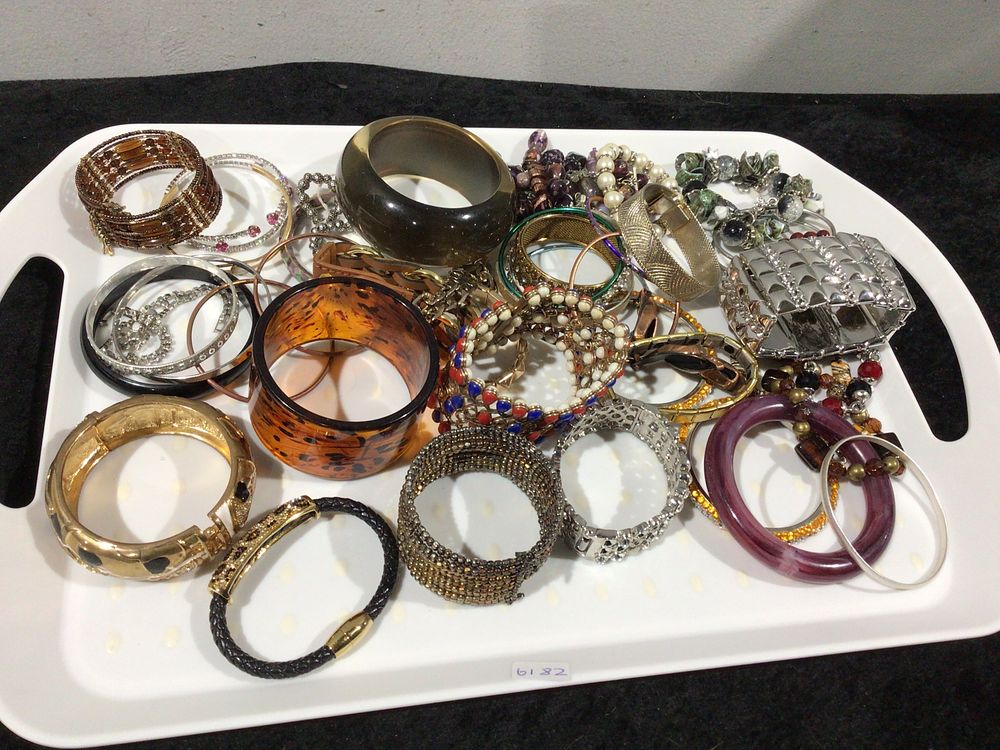 Lot 292: A Collection of Approximately Two Dozen Fashion Costume Bracelets