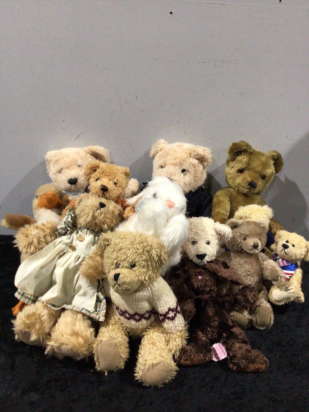 Lot 293: A Collection of Approximately Fourteen Boyds Bears and Other Stuffed Animals