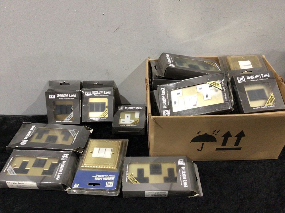 Lot 399: A Collection of CED Decorative Range Brass-Fronted Electrical Fittings