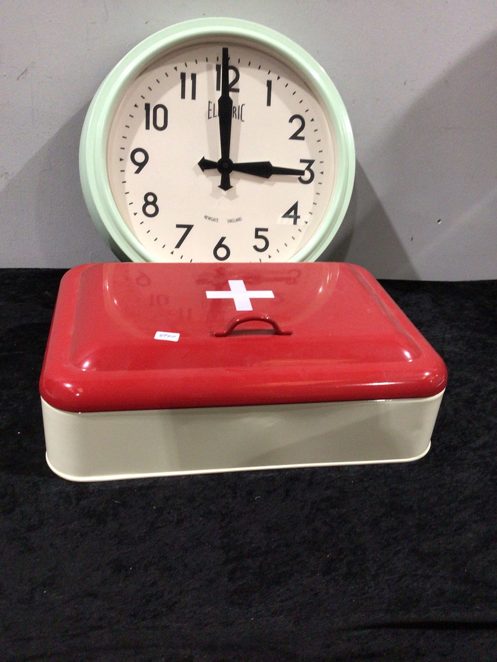 Lot 446: A Newgate England Electric Wall Clock and a Vintage Style Metal First Aid Box
