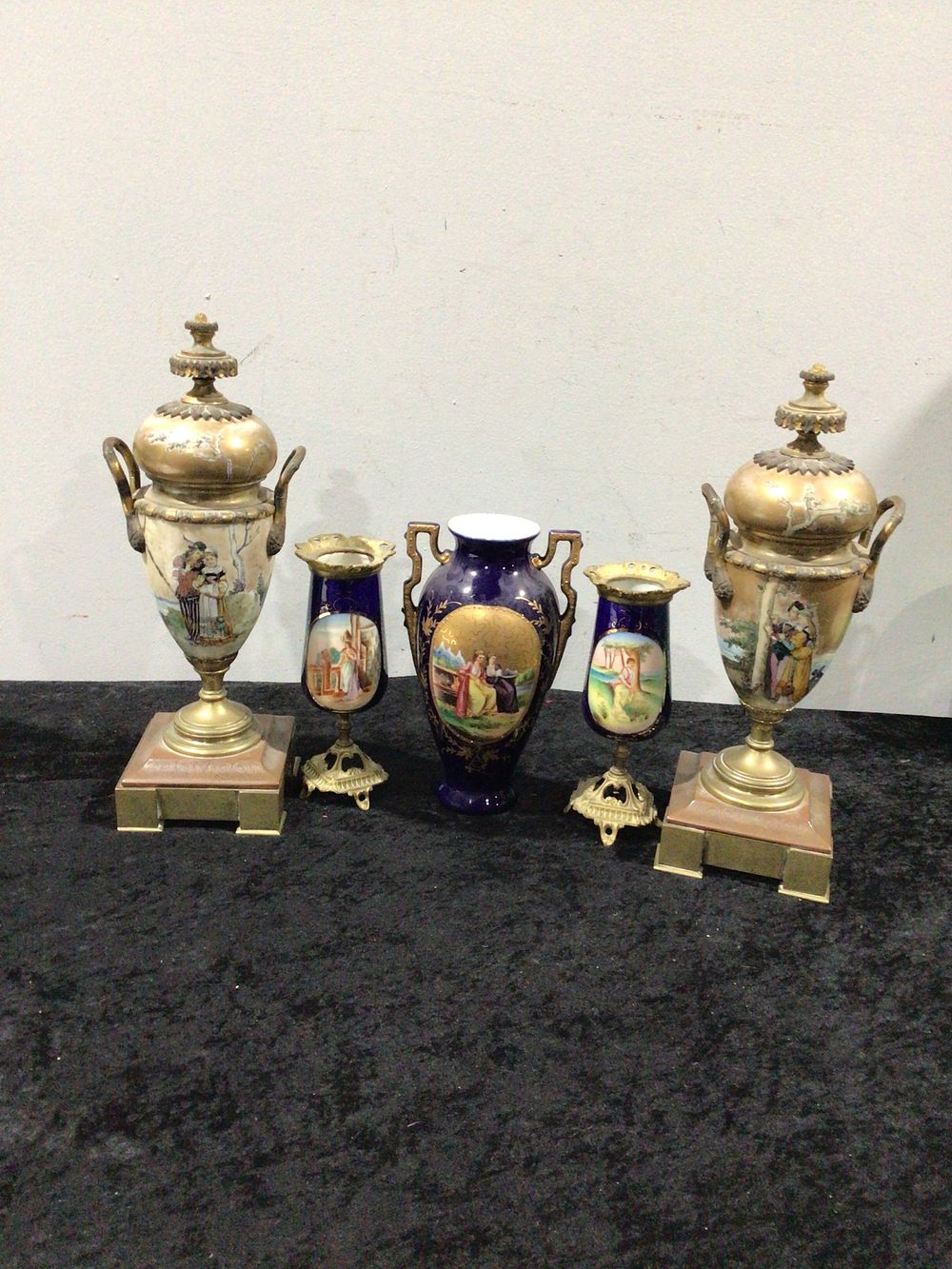 Lot 458: A Collection of Royal Vienna Porcelain Cobalt Blue Ground Urns, Vase, and Goblets