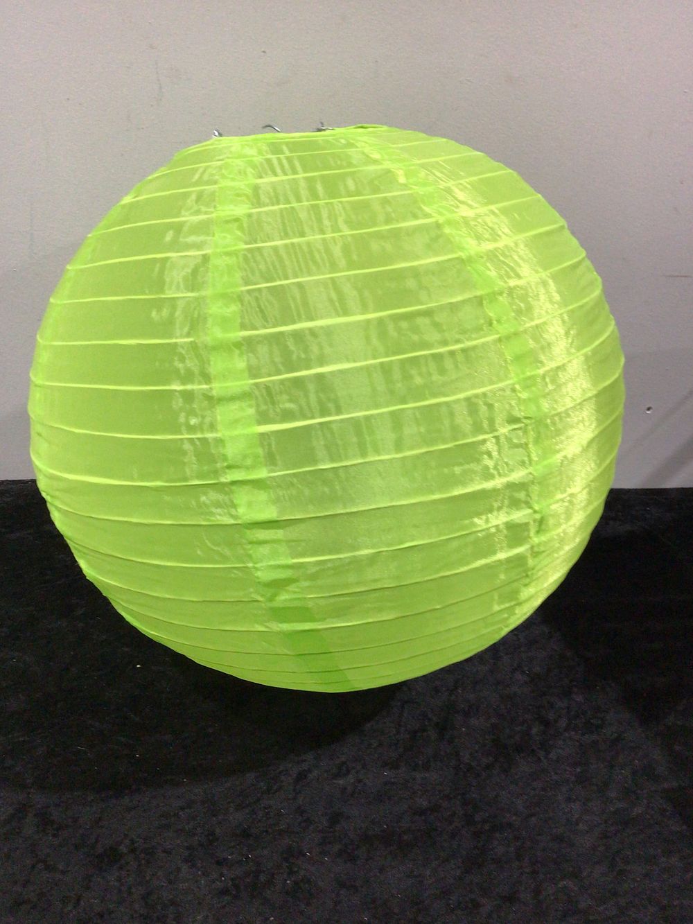 Lot 204: A Group of 50 Lime Green Round Paper Lanterns