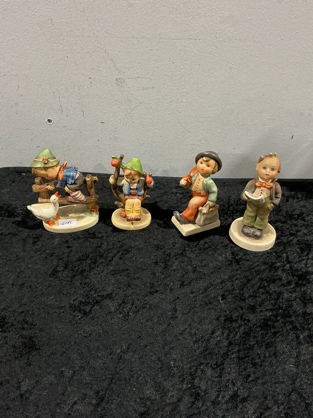 Lot 198: A Collection of Four Goebel Hummel Style Ceramic Figurines