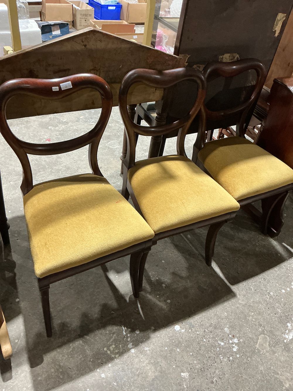 Lot 232: A Trio of Victorian Style Dark-Stained Balloon Back Side Chairs