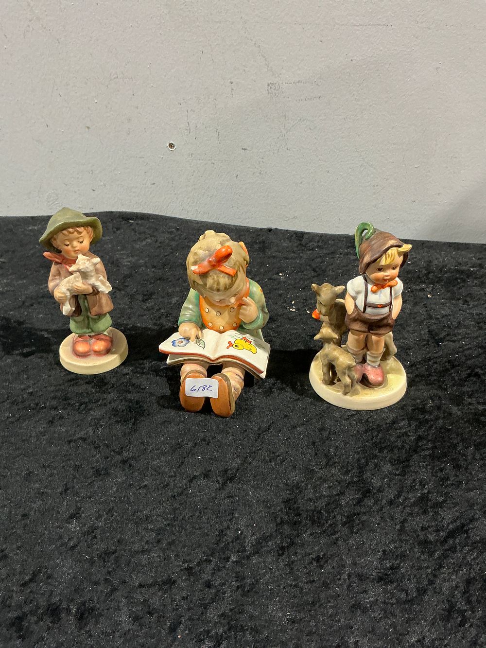 Lot 266: A Trio of Goebel Hummel Porcelain Figurines