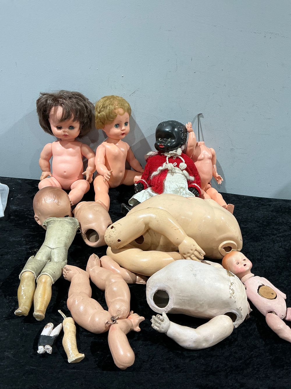 Lot 306: A Collection of 24 Vintage and Antique Assorted Doll Parts and Incomplete Figures