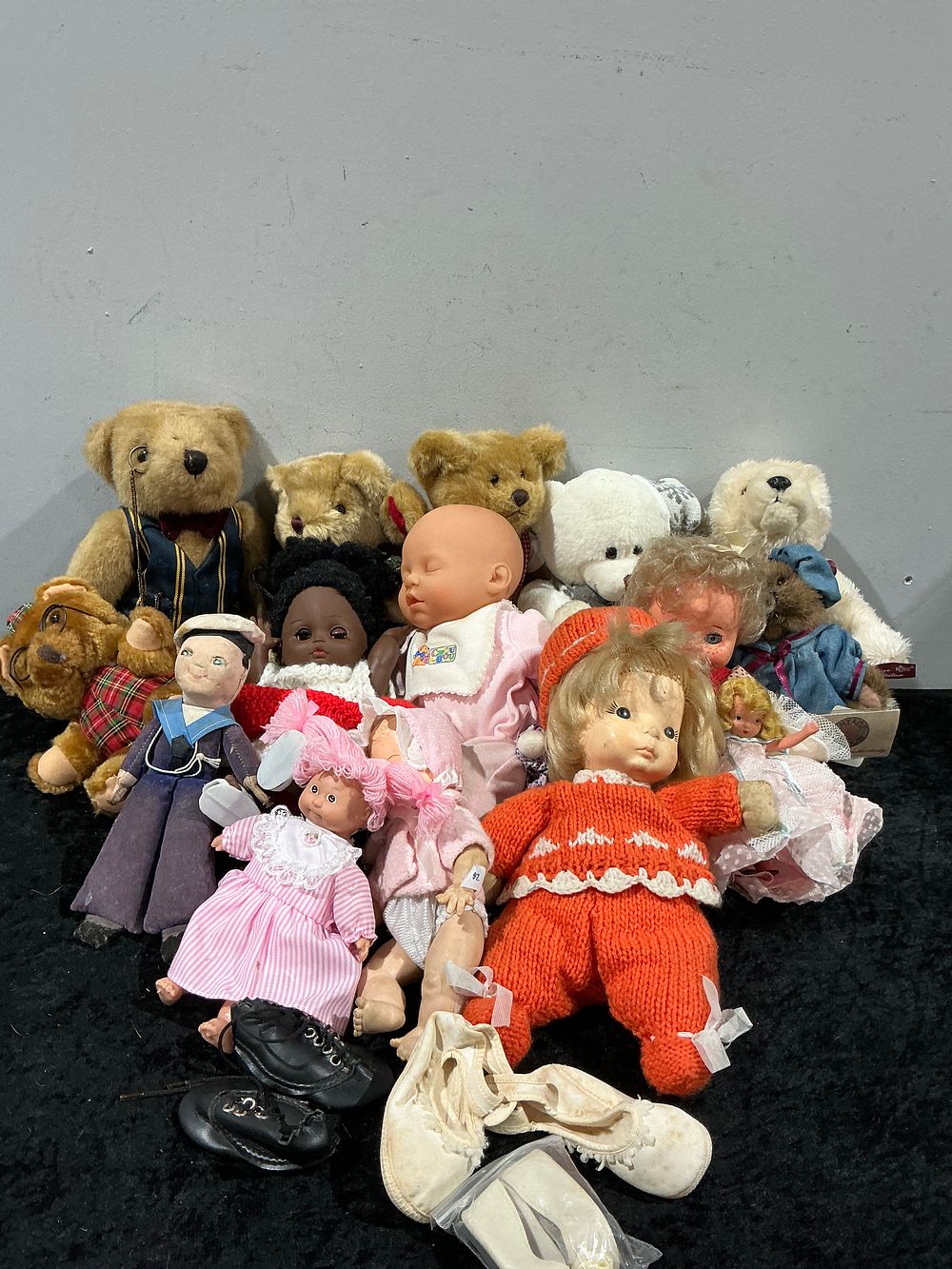 Lot 313: A Collection of 18 Assorted Dolls, Plush Toys, and Accessories