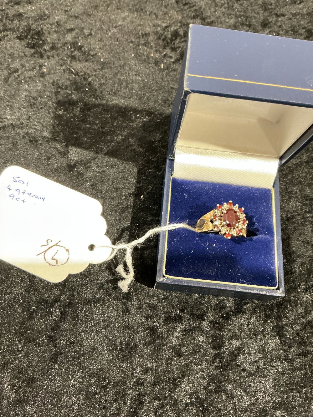Lot 347: A 9ct Gold Garnet and Pearl Cluster Ring