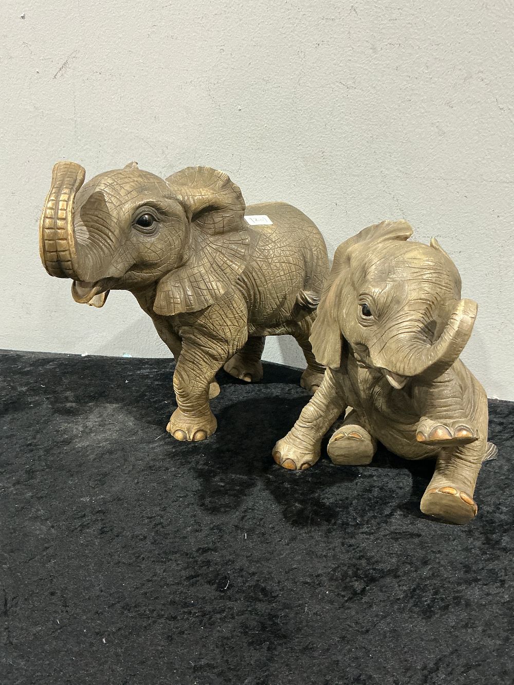 Lot 403: A Pair of Naturalistic Elephant Calf Figurines