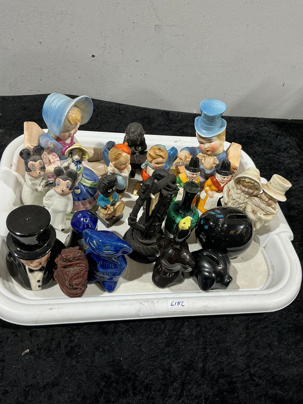 Lot 409: A Collection of 19 Mixed Novelty Figurines and Collectibles, Including Disney-Style Miniatures